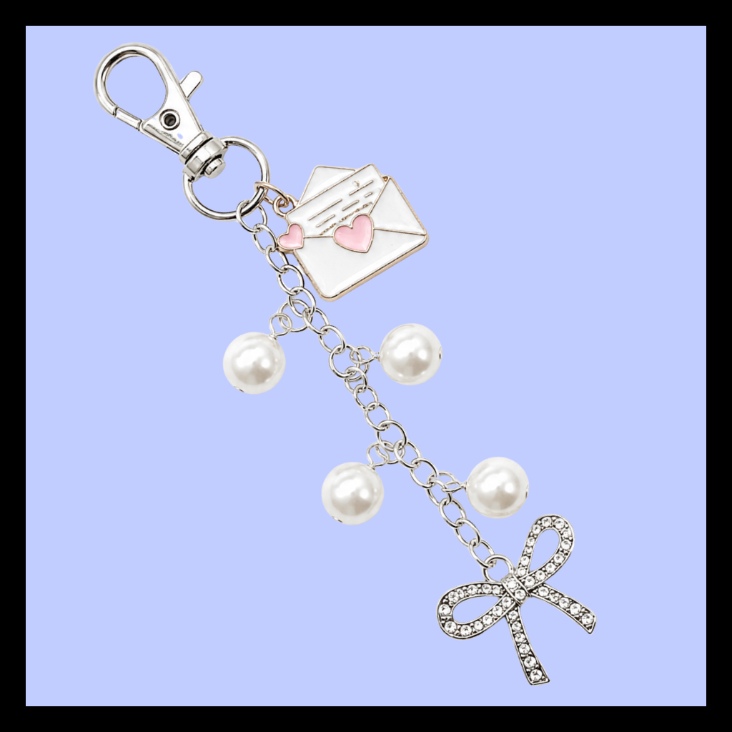 Silver Envelope Keychain Charm With Pink Heart Detail White Pearl Beads Rhinestone Bow Pendant Four Inch Length Lobster Clasp Attachment Romantic Bag Accessory Gift Cute Purse Charm Elegant Design Sparkling Crystal Bow Accent Fashion