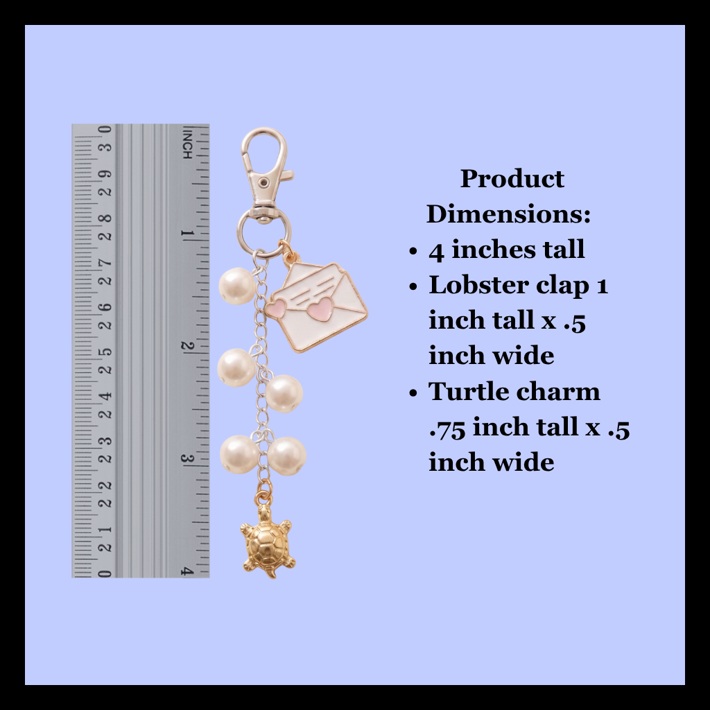 Silver lobster clasp keychain charm with a small envelope charm, pearl beads, and a turtle charm, shown next to a ruler for scale and product dimension text on a light blue background.
