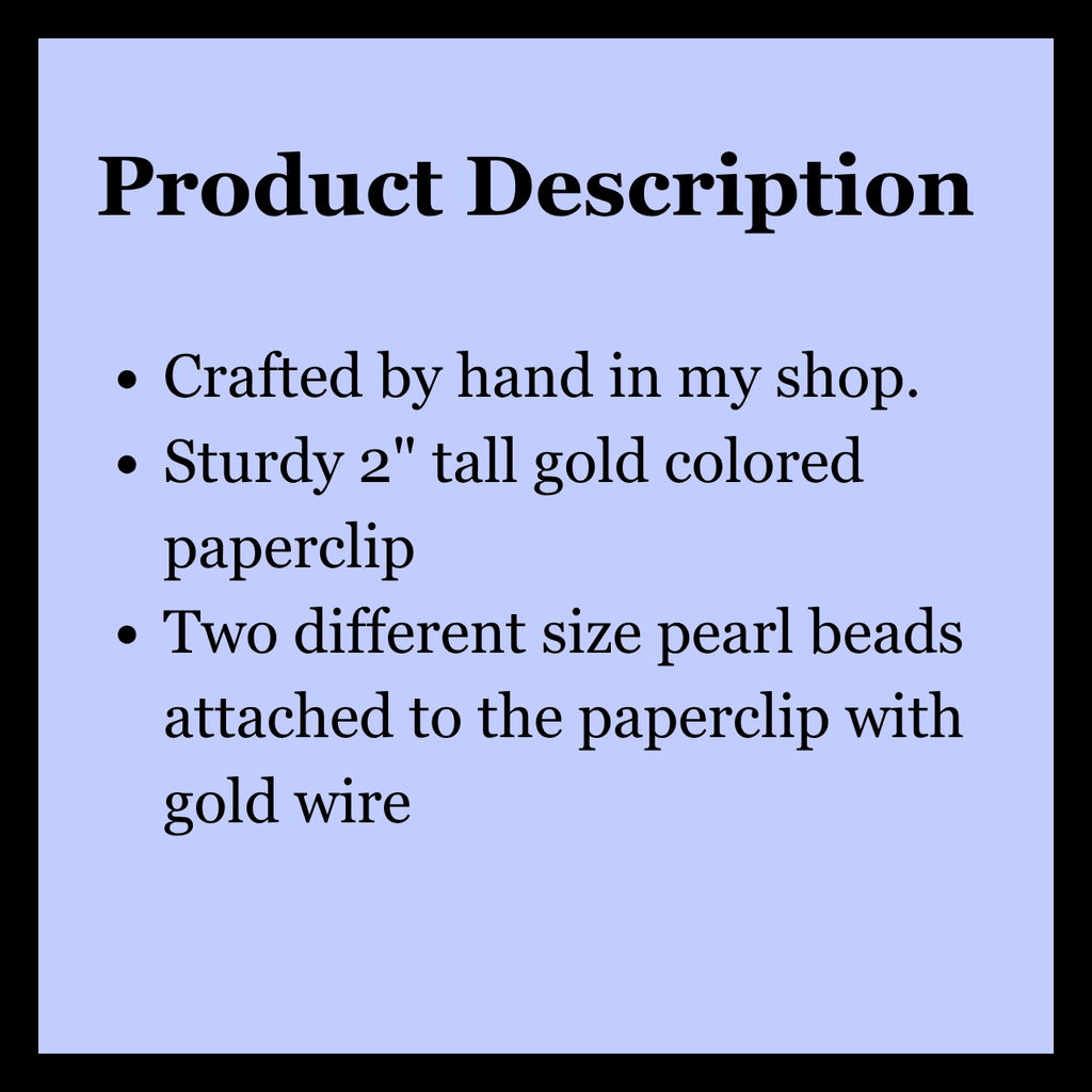 A product description card with a light blue background and black border, featuring black text that reads: 'Product Description' followed by bullet points about a handmade paperclip with pearl beads and gold wire.
